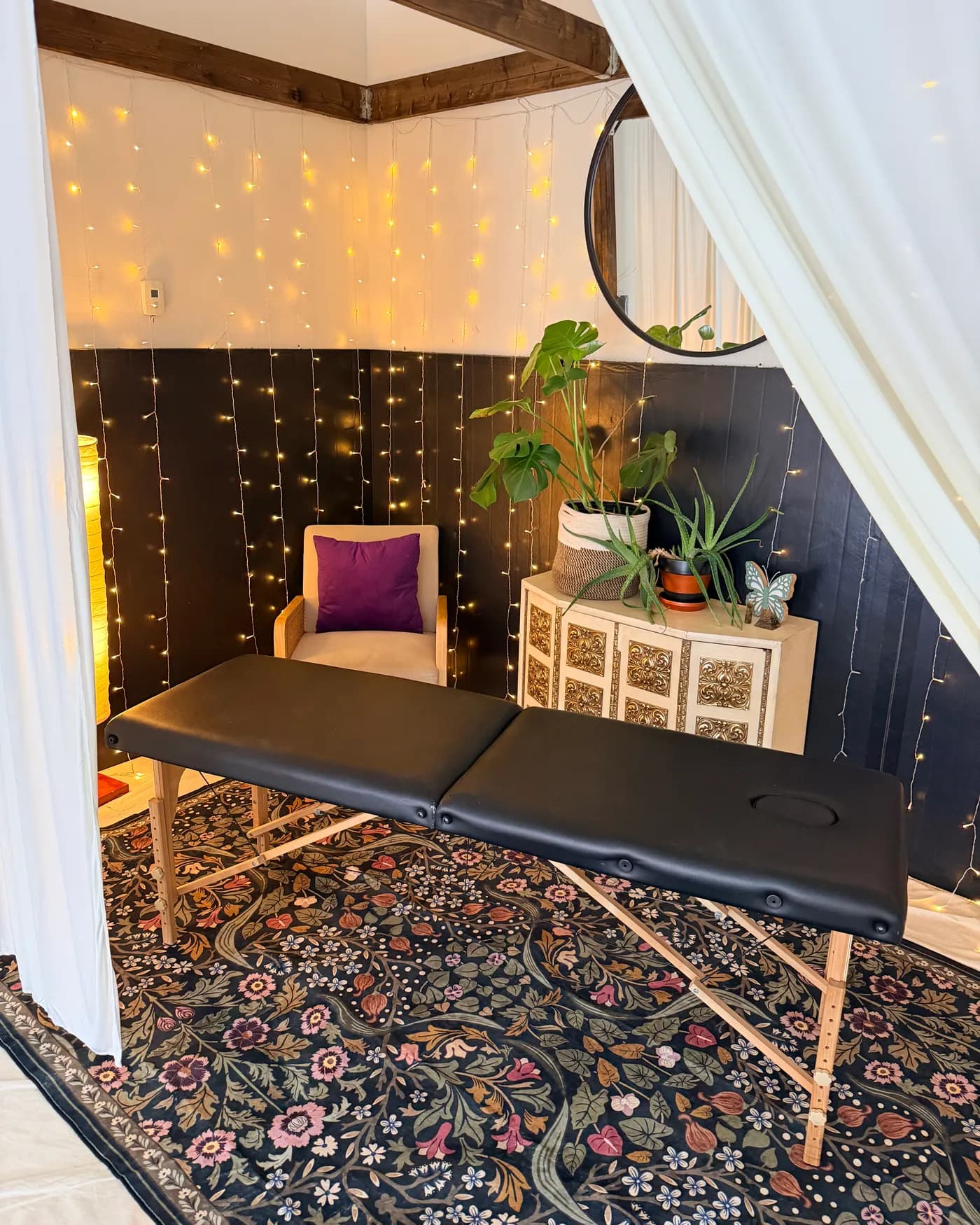 The massage treatment space at Luna Alchemy - table, soft lights, and plants